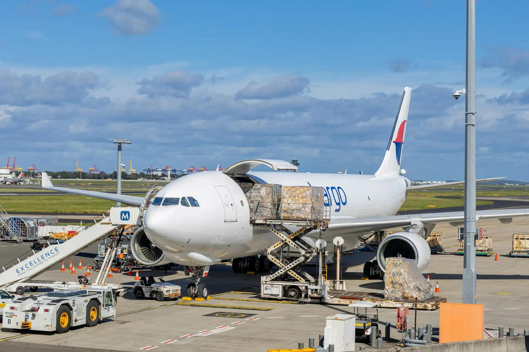 Cargo aircraft being loaded on an airport apron