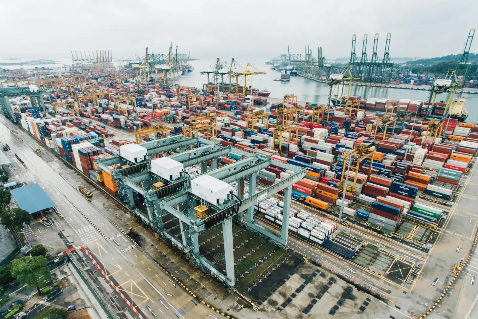 Aerial view of shipping containers stacked at a container terminal